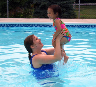Mommy can throw me high in the pool!